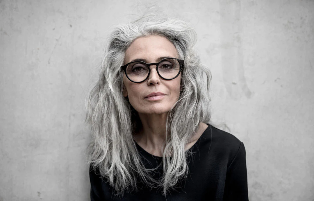 Mature Woman With Grey Hair Wearing Black Glasses